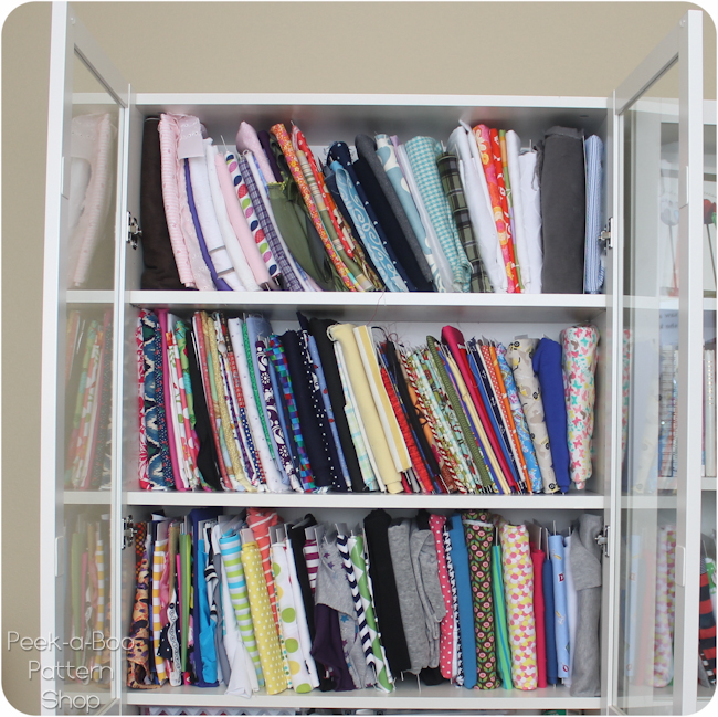 Fabric storage using Ikea Billy shelves and comic book boards to wrap the  fabric